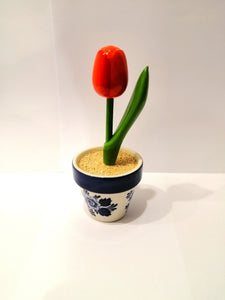 Wooden tulip in a pottery jarوردة خشب في اناء فخار